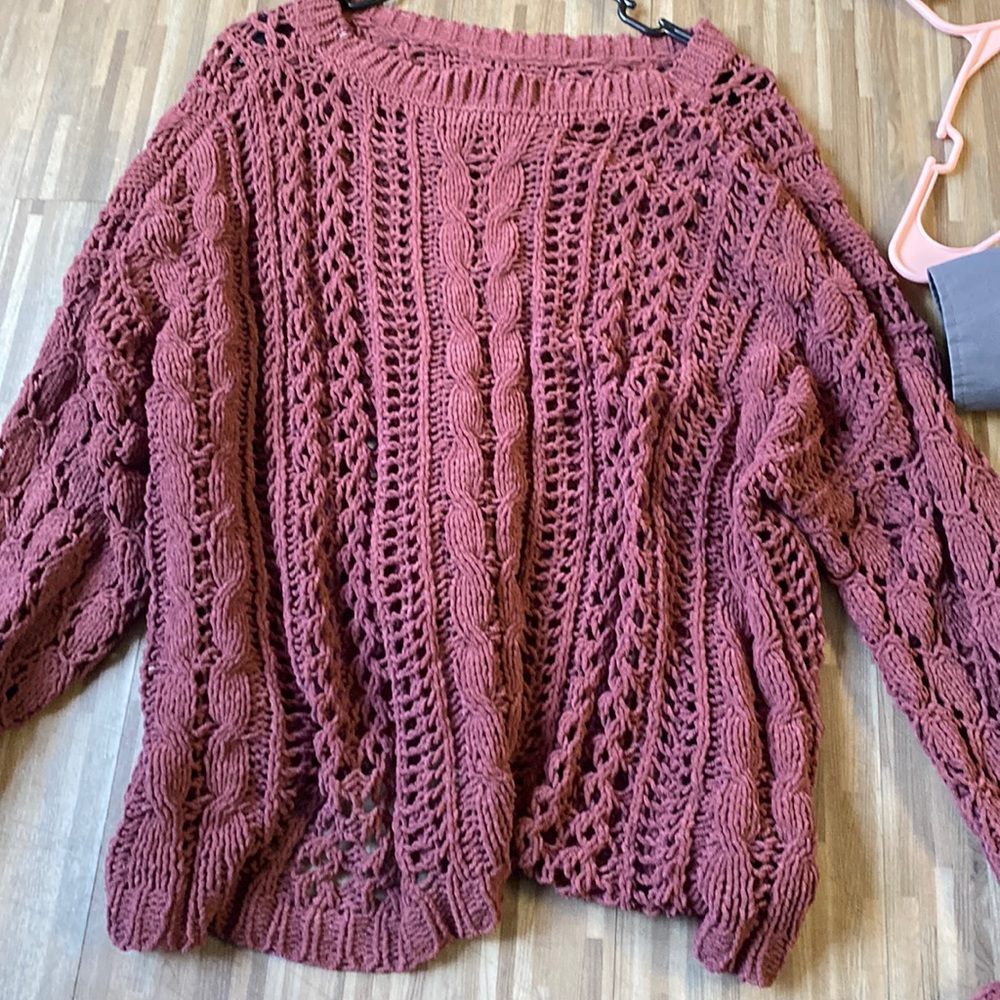 Maroon sweater.